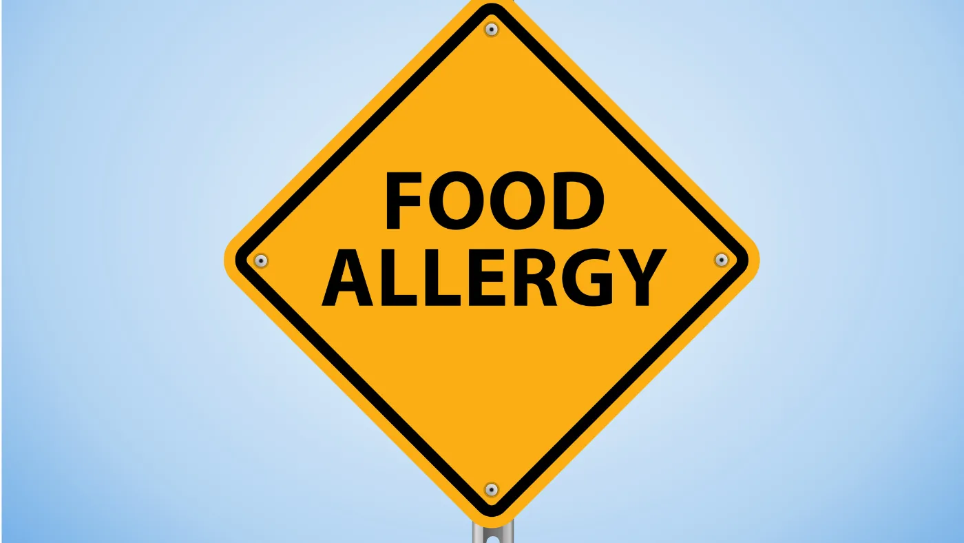 「FOOD ALLERGY」と書かれた黄色いひし形の注意標識